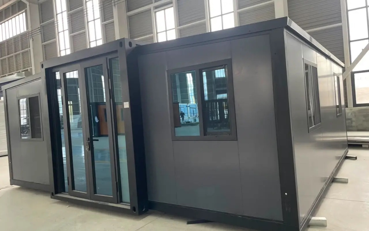 Prefabricated home modules under construction in a controlled facility