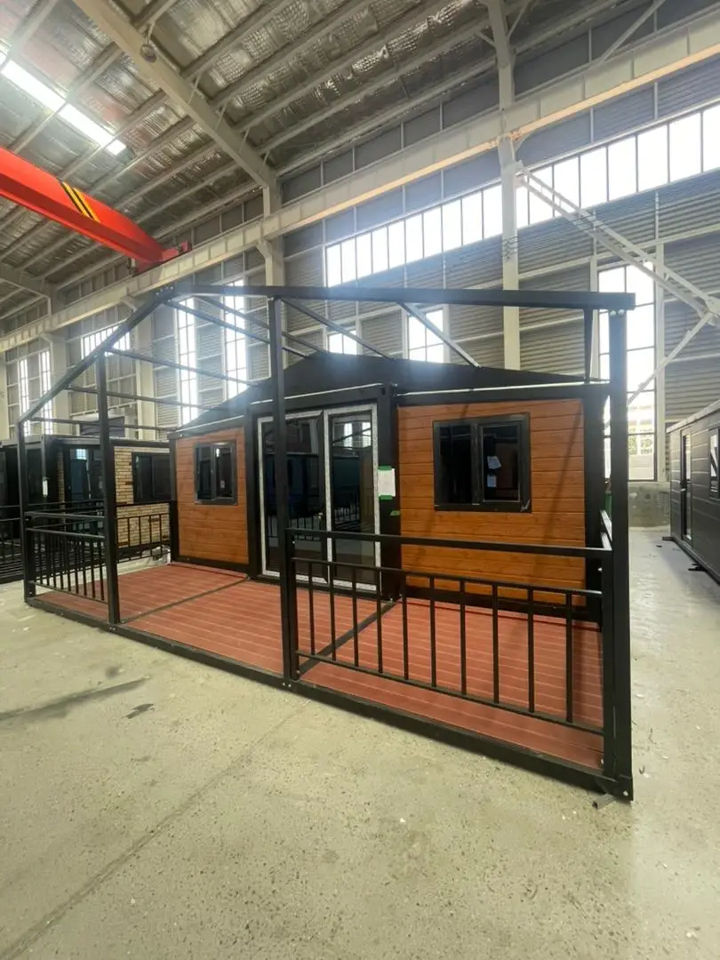 Wood-look modular home with porch framing inside a production facility